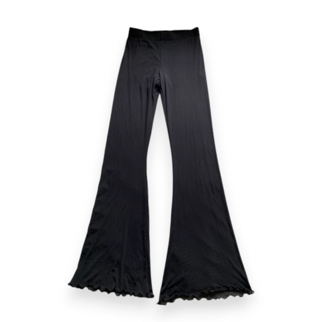 Black lettuce hem flare beach / lounge pants (Category: Other Bottoms) located in Rizal. Submitted by sheeraay (Listing ID 1467675472, Image 1). Description: - Color: Black - Style: Full length flare pants - Waistband: Stretchy and comfortable - Hem: Cute lettuce trim detail - Material: Lightweight, flowy, and easy to move in.