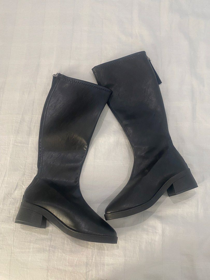 Black Long Boots Knee High (Category: Boots) located in Dasmarinas. Submitted by closetcleanser_ (Listing ID 1467706773, Image 1). Description: - Size: 39 - Style: Knee-high boots with chunky block heels and rounded toes - Closure: Back zip for easy wear - Versatility: Great to style with skirts or skinny jeans for cooler weather.