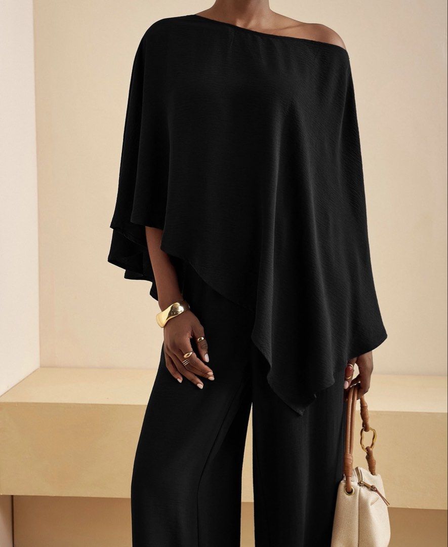 Black One-Shoulder Asymmetric Cape coordinates set (Category: Sets & Coordinates) located in Makati City. Submitted by prelovedloot (Listing ID 1467739727, Image 2). Description: - Color: Classic Black - Design: Asymmetric one-shoulder with chic overlay cape detail - Fit: Flattering wide-leg silhouette - Material: Lightweight, textured fabric with a clean drape - Occasion: Perfect for evening events, dinners, and formal gatherings - Condition: Ex