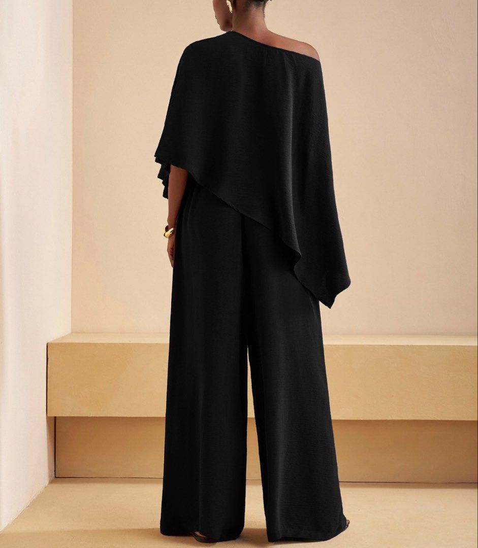 Black One-Shoulder Asymmetric Cape coordinates set (Category: Sets & Coordinates) located in Makati City. Submitted by prelovedloot (Listing ID 1467739727, Image 3). Description: - Color: Classic Black - Design: Asymmetric one-shoulder with chic overlay cape detail - Fit: Flattering wide-leg silhouette - Material: Lightweight, textured fabric with a clean drape - Occasion: Perfect for evening events, dinners, and formal gatherings - Condition: Ex