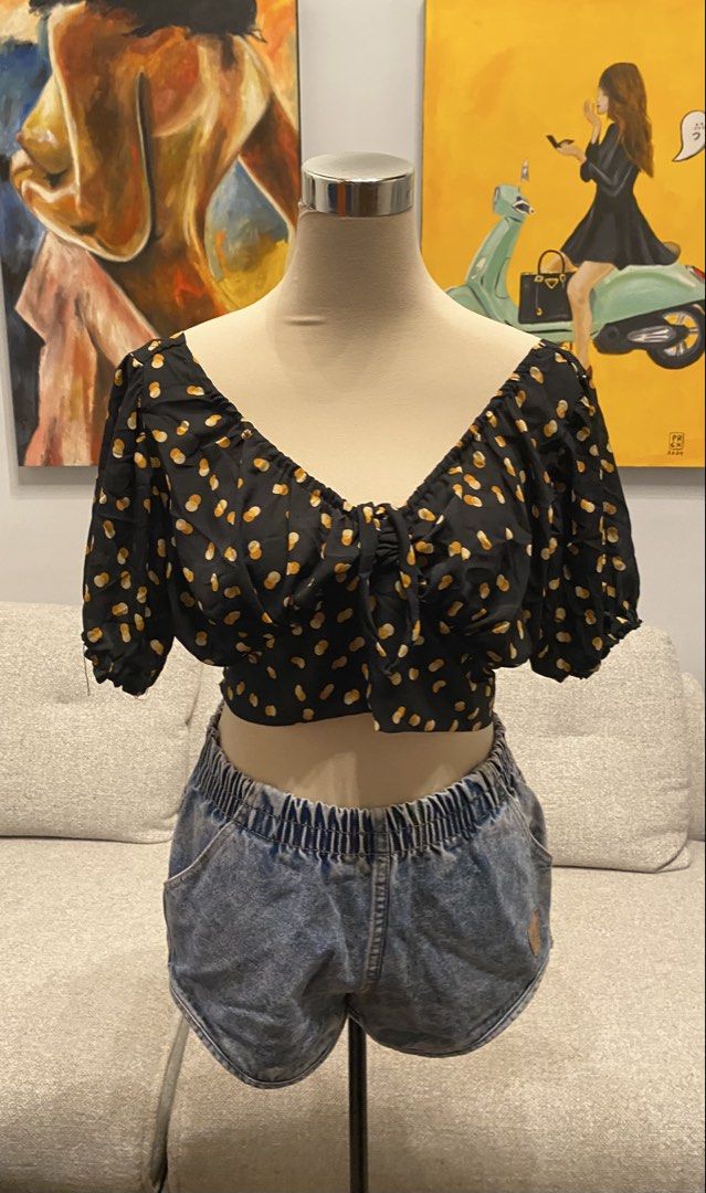 Black Polka Dot Tie-Back Crop Top Puff Sleeve (Category: Blouses) located in Caloocan City. Submitted by yzaaaaaviles (Listing ID 1467784281, Image 1). Description: - Color/Pattern: Black with all-over yellow polka dots - Neckline: Sweetheart neckline with front tie detail - Sleeves: Puff sleeves with comfortable elastic cuffs - Back Design: Dramatic low V-back with a bottom tie closure - Material: Lightweight and breathable, ideal for warm weath