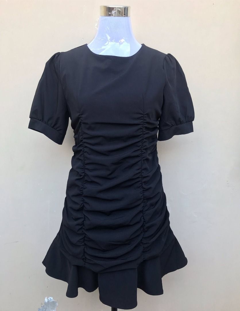 Black Ruched Mini Dress with Ruffle Hem (Category: Dresses) located in Quezon City. Submitted by ezrakeith (Listing ID 1467807914, Image 1). Description: - Color: Black - Style: Short dress with heavy front & back ruching - Details: Round neckline, short puffed sleeves, and ruffle hem - Material: Smooth and structured - Best for: Parties, dates, or casual nights out - Condition: Brand new / Excellent - Shipping: Same-day delivery available (Metro