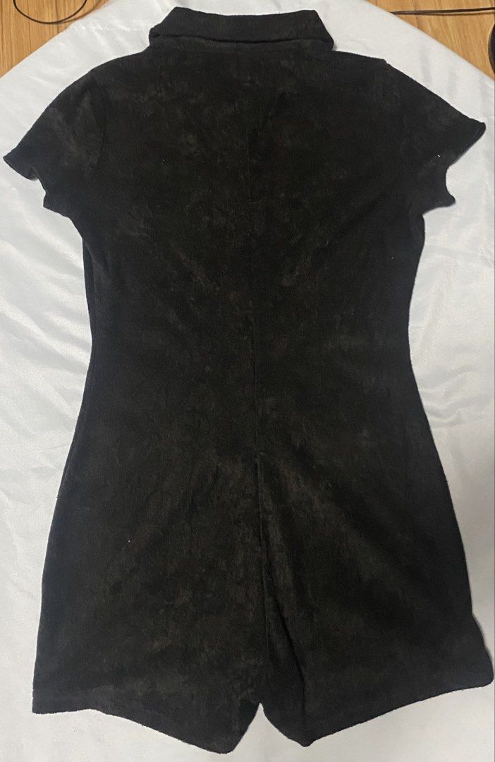 Black short sleeve button front collared romper size S (Category: Rompers) located in Paranaque City. Submitted by pomeloluvr (Listing ID 1467680033, Image 3). Description: - Color: Black - Size: S - Material: Soft Corduroy Like Textured fabric - Design: Collar neckline with tortoiseshell front buttons - Fit: Fitted waist with attached shorts - Condition: Clean hems and tidy stitching throughout.