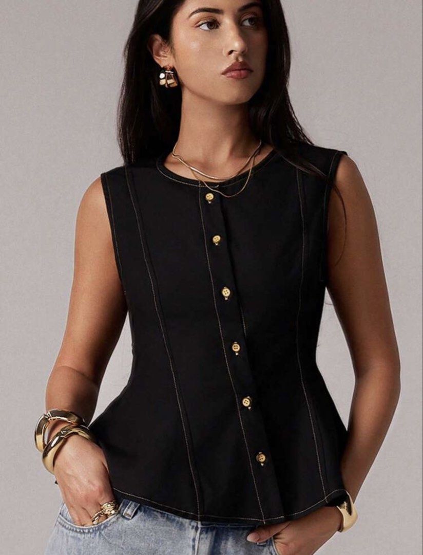 Black Sleeveless Peplum Top (Category: Sleeveless) located in Manila. Submitted by ellaaamn (Listing ID 1467768596, Image 1). Description: Never worn! RFS: Too small on me :( - Color: Black - Style: Sleeveless top with a flared peplum hem and structured bodice - Condition: Brand new / Excellent quality.
