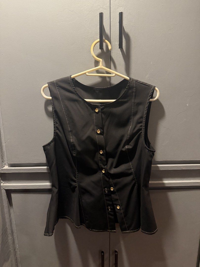 Black Sleeveless Peplum Top (Category: Sleeveless) located in Manila. Submitted by ellaaamn (Listing ID 1467768596, Image 3). Description: Never worn! RFS: Too small on me :( - Color: Black - Style: Sleeveless top with a flared peplum hem and structured bodice - Condition: Brand new / Excellent quality.