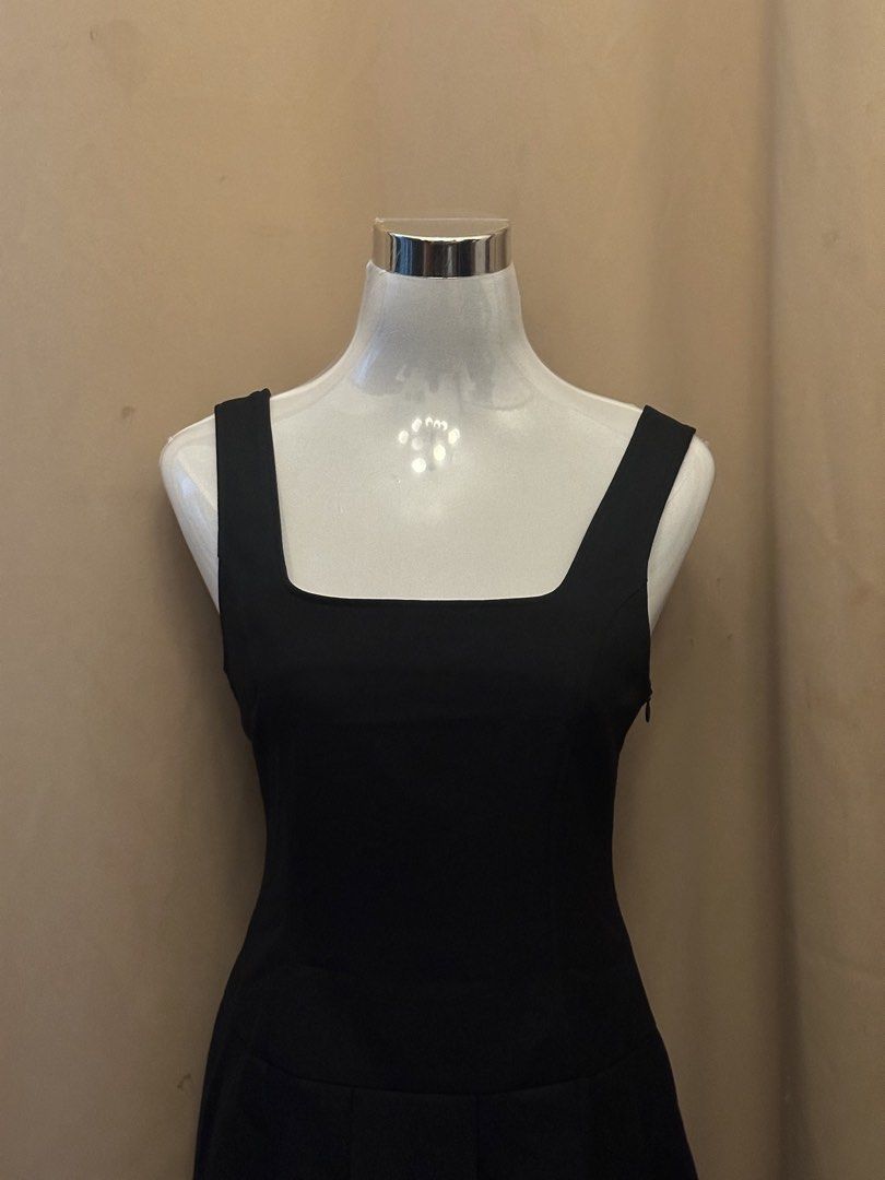 Black Square Neck Pleated A-Line Dress (Category: Dresses) located in Manila. Submitted by jade_preloved19 (Listing ID 1467672073, Image 2). Description: - Style: Classic black dress with clean lines - Neckline & Straps: Square neckline with thick straps - Fit & Silhouette: Fitted bodice with a flared box-pleat skirt (mid-thigh length) - Closure: Hidden side zipper - Fabric: Smooth finish - Occasion: Versatile for dinners, parties, or everyday sm