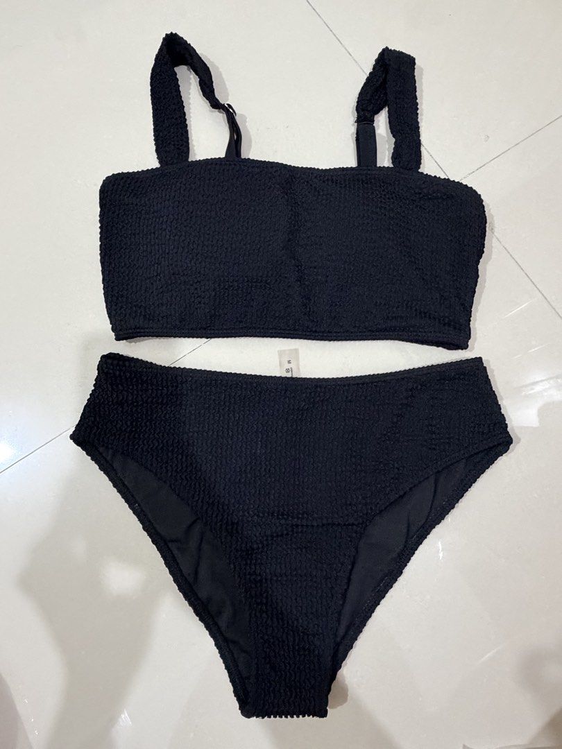 Black textured two-piece bikini set high-waisted size M (Category: Bikinis & Swimsuits) located in Kalibo. Submitted by goodfinds.club (Listing ID 1467739672, Image 1). Description: - Color: Solid Black - Size: M (tag attached) - Material: Textured crinkle fabric - Top: Strappy crop top with adjustable straps - Bottoms: Matching high-waisted style - Condition: Clean, great for the beach or pool.