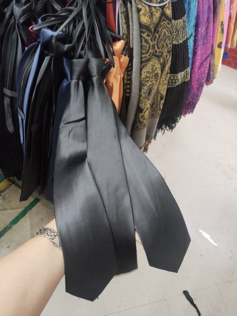 Black Zipper Ties Formal Neckties (Category: Ties) located in Manila. Submitted by zdmal (Listing ID 1467623627, Image 2). Description: - Color: Classic plain black - Design: Built-in zipper mechanism (no tying needed, easy to put on and take off) - Finish: Smooth fabric with a subtle shine - Size: Standard width blade - Ideal for: School uniforms, formal events, and office wear - Condition: Neat and ready to use - Stock: Multiple pieces availabl