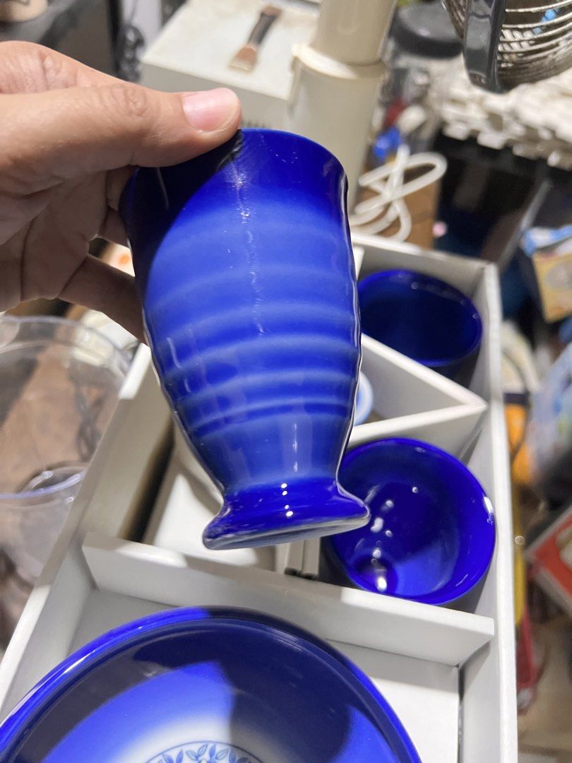 Blue and White Ceramic Cup and Plate Gift Set (Category: Dinnerware & Cutlery) located in Manila. Submitted by suarezbaby04975 (Listing ID 1467726731, Image 3). Description: - Deep blue ceramic matching set - Includes 4 cups, 1 small holder, and 1 large serving plate - Beautiful floral wreath pattern in the center of the plate - Ideal for daily tea time or serving snacks - Packed in original white presentation box, great for gifts Carefully packe