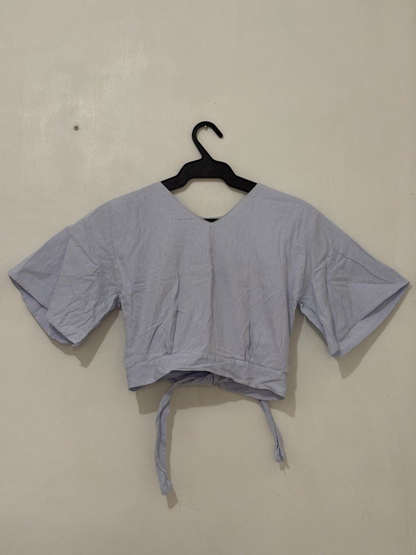 Blue Blouse with Back Ribbon (Category: Blouses) located in Quezon City. Submitted by chrissie__ (Listing ID 1467684319, Image 1). Description: ▪️ Minimal stain on the neckline (removable with thorough wash) .