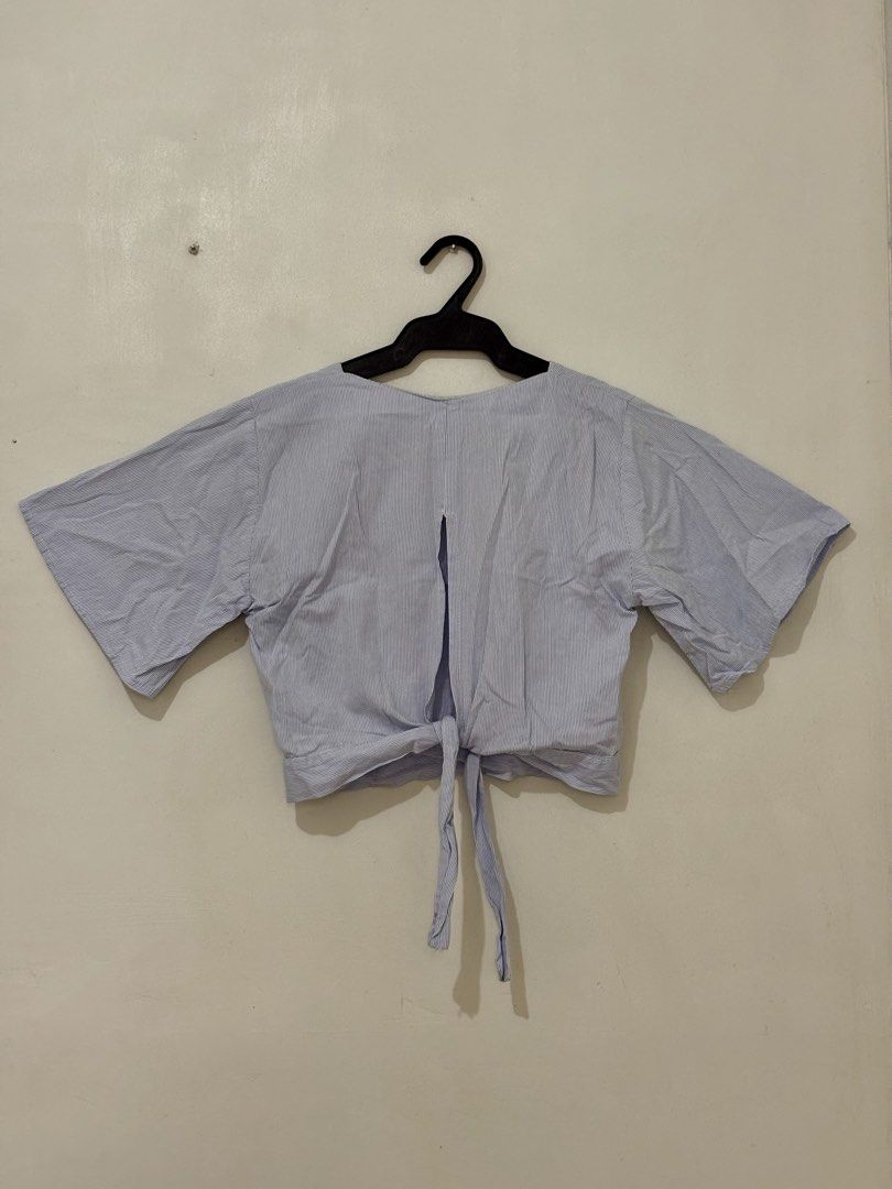 Blue Blouse with Back Ribbon (Category: Blouses) located in Quezon City. Submitted by chrissie__ (Listing ID 1467684319, Image 2). Description: ▪️ Minimal stain on the neckline (removable with thorough wash) .