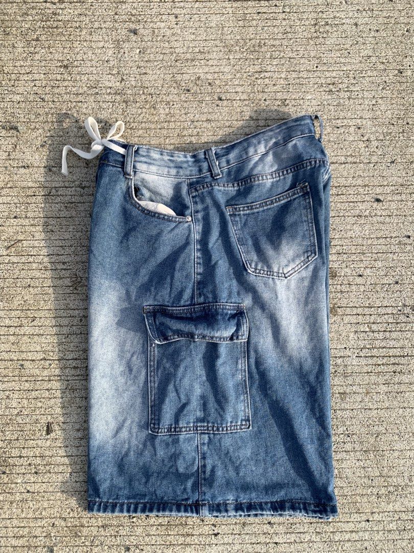 Blue Denim Cargo Shorts with Drawstring Waist (Category: Shorts) located in Iloilo. Submitted by johnpullan30303 (Listing ID 1467610975, Image 3). Description: - Style: Casual streetwear blue denim cargo shorts - Finish: Trendy washed finish with a relaxed fit - Waist: Adjustable white drawstring tie - Storage: Multiple functional pockets on the sides and back - Condition: Brand new / Excellent quality - Perfect for: Daily lakad, tambay, and casu