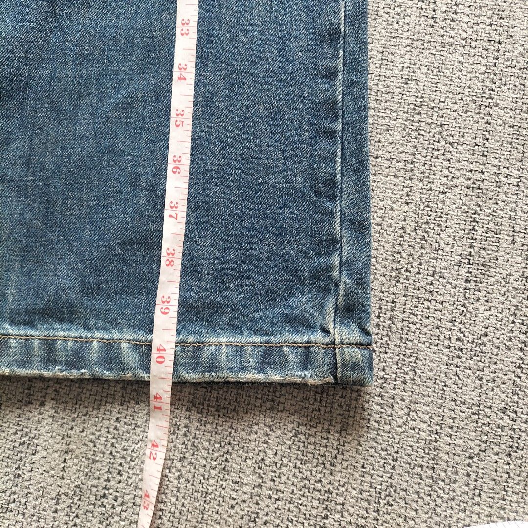 Blue Distressed Boot cut Jeans Denim Pants (Category: Jeans) located in Taytay. Submitted by calmtree-6248 (Listing ID 1467637267, Image 2). Description: - Style: Classic Y2K mid-rise flare jeans - Details: Whiskering, distressed knees/legs, and slight thigh fading - Closure: Metal button fly - Measurements: Waist width ~16", Total length ~42", Inseam ~31.5" - Condition: Excellent, ready to wear.