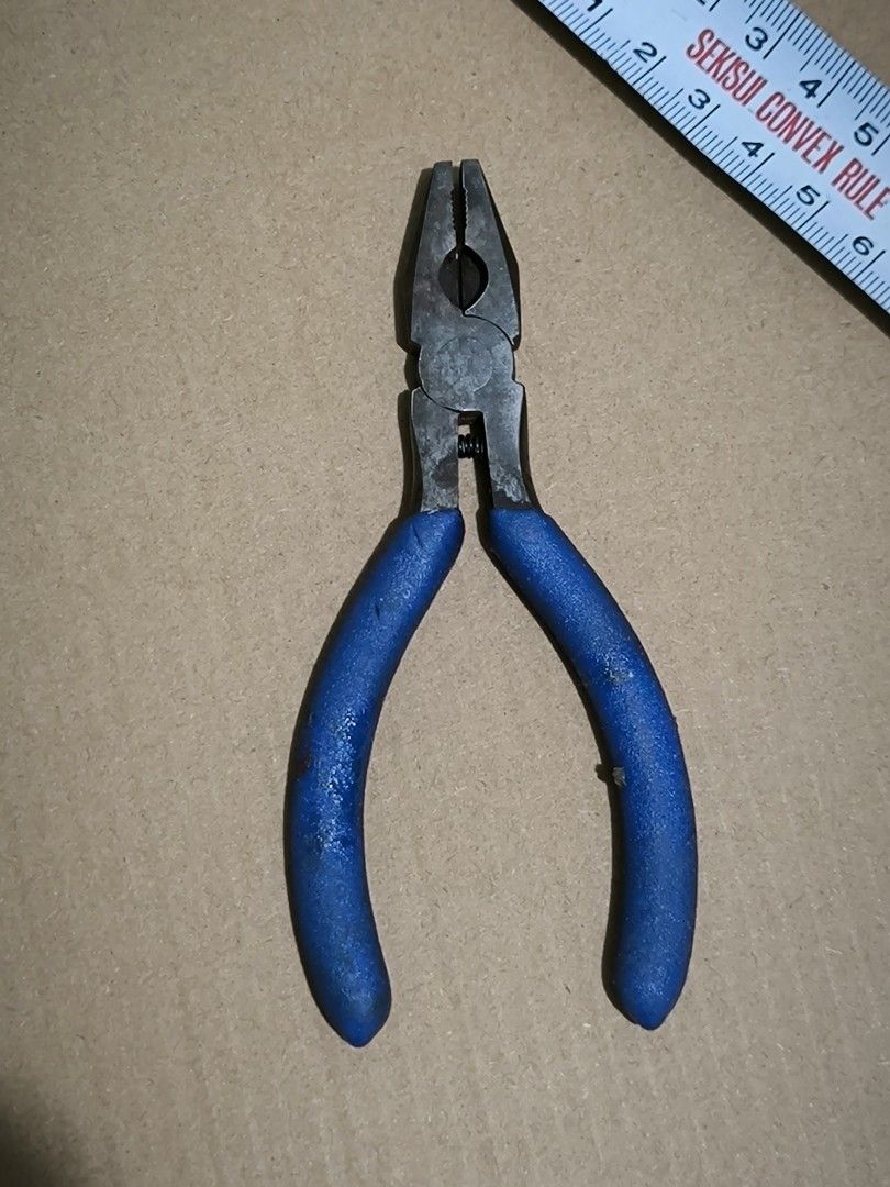 Blue handle combination pliers with return spring (Category: Home Improvement Tools & Accessories) located in Angeles City. Submitted by yellowbrickstore (Listing ID 1467685571, Image 2). Description: - Compact combination pliers, fits easily in any tool belt or pouch - Blue rubber grips for comfortable handling - Built-in return spring near the pivot for easy one-handed operation - Textured jaws provide a strong grip for bending, holding, and wi