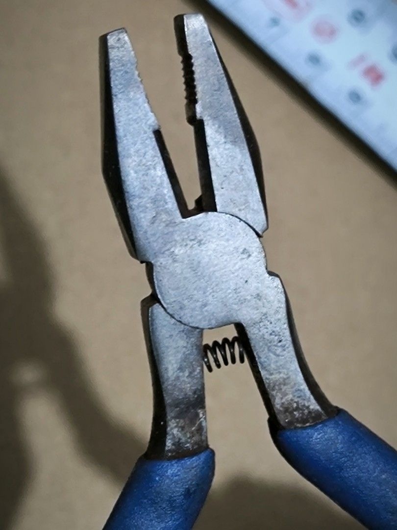 Blue handle combination pliers with return spring (Category: Home Improvement Tools & Accessories) located in Angeles City. Submitted by yellowbrickstore (Listing ID 1467685571, Image 3). Description: - Compact combination pliers, fits easily in any tool belt or pouch - Blue rubber grips for comfortable handling - Built-in return spring near the pivot for easy one-handed operation - Textured jaws provide a strong grip for bending, holding, and wi