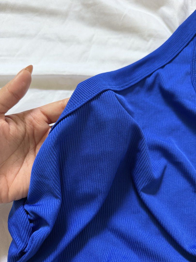 Blue One-Shoulder Ribbed Tank Top (Category: Sleeveless) located in Las Pinas. Submitted by ann.co. (Listing ID 1467683522, Image 2). Description: - Color: Royal blue - Design: One-shoulder neckline with side ruching - Material: Soft, stretchy ribbed knit - Fit: Sleeveless, easy to pair with high-waisted jeans or skirts .