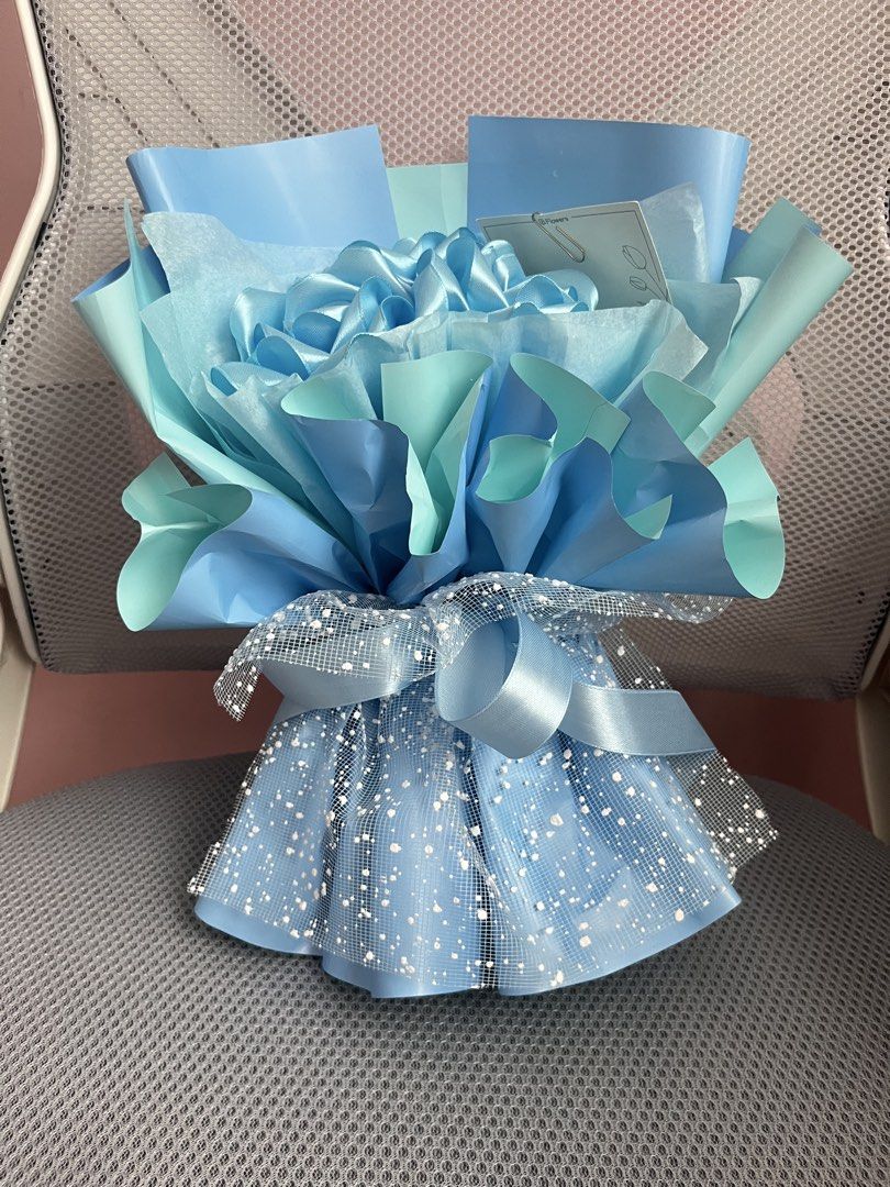 Blue Satin Rose Bouquet (Category: Flowers & Bouquets) located in Pasig City. Submitted by megistus (Listing ID 1467643237, Image 2). Description: ‼️PHP 200 LAST PRICE‼️ - Includes a blank gift card - bought from orange app rfs: di naibigay sa pagbibigyan mode of payment: gcash mode of delivery: lalamove *shipping fee is shouldered by buyer.
