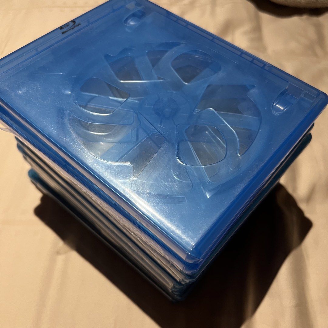 Blu-ray Empty Casing (Category: CDs & DVDs) located in Singapore. Submitted by sgguyz (Listing ID 1467795367, Image 2). Description: Stack of 10 blue plastic Blu-ray cases. Standard size fits movies and games. Good for replacing broken covers or storing loose discs. Clear outer sleeve for insert art. Eco cut out design with silver logo and snap closure..