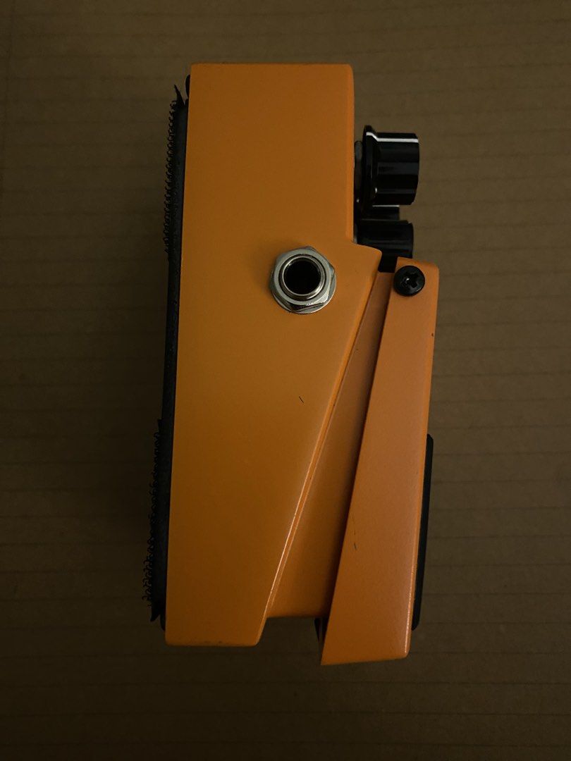 Boss DS-1 Distortion Guitar Pedal (Category: Musical Instruments) located in Muntinlupa City. Submitted by lucky_mikhail.enver (Listing ID 1467652072, Image 3). Description: - Iconic Boss DS-1 distortion pedal with classic orange finish - Simple 3-knob layout: Tone, Level, and Dist for versatile rock tones - Made in Malaysia with Roland Corporation label underneath - Equipped with velcro strips on the bottom plate for easy pedalboard mounting - S