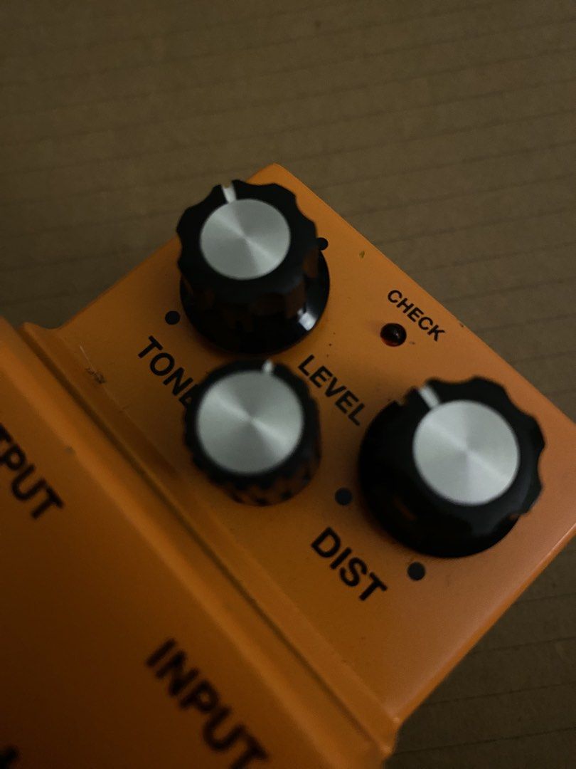 Boss DS-1 Distortion Guitar Pedal (Category: Musical Instruments) located in Muntinlupa City. Submitted by lucky_mikhail.enver (Listing ID 1467652072, Image 2). Description: - Iconic Boss DS-1 distortion pedal with classic orange finish - Simple 3-knob layout: Tone, Level, and Dist for versatile rock tones - Made in Malaysia with Roland Corporation label underneath - Equipped with velcro strips on the bottom plate for easy pedalboard mounting - S