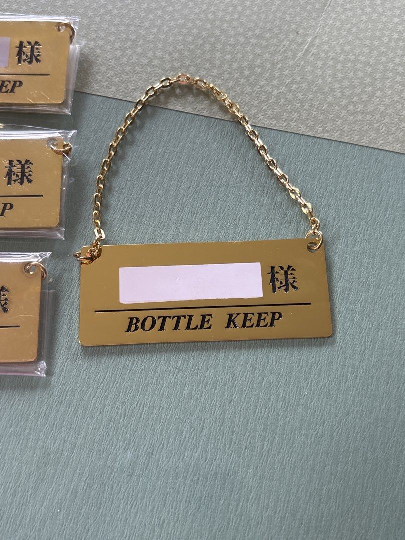 Bottle keep gold metal with chain tag (Category: Wine Cellar & Storage) located in Calamba. Submitted by cur8d (Listing ID 1467646195, Image 3). Description: 50 each.