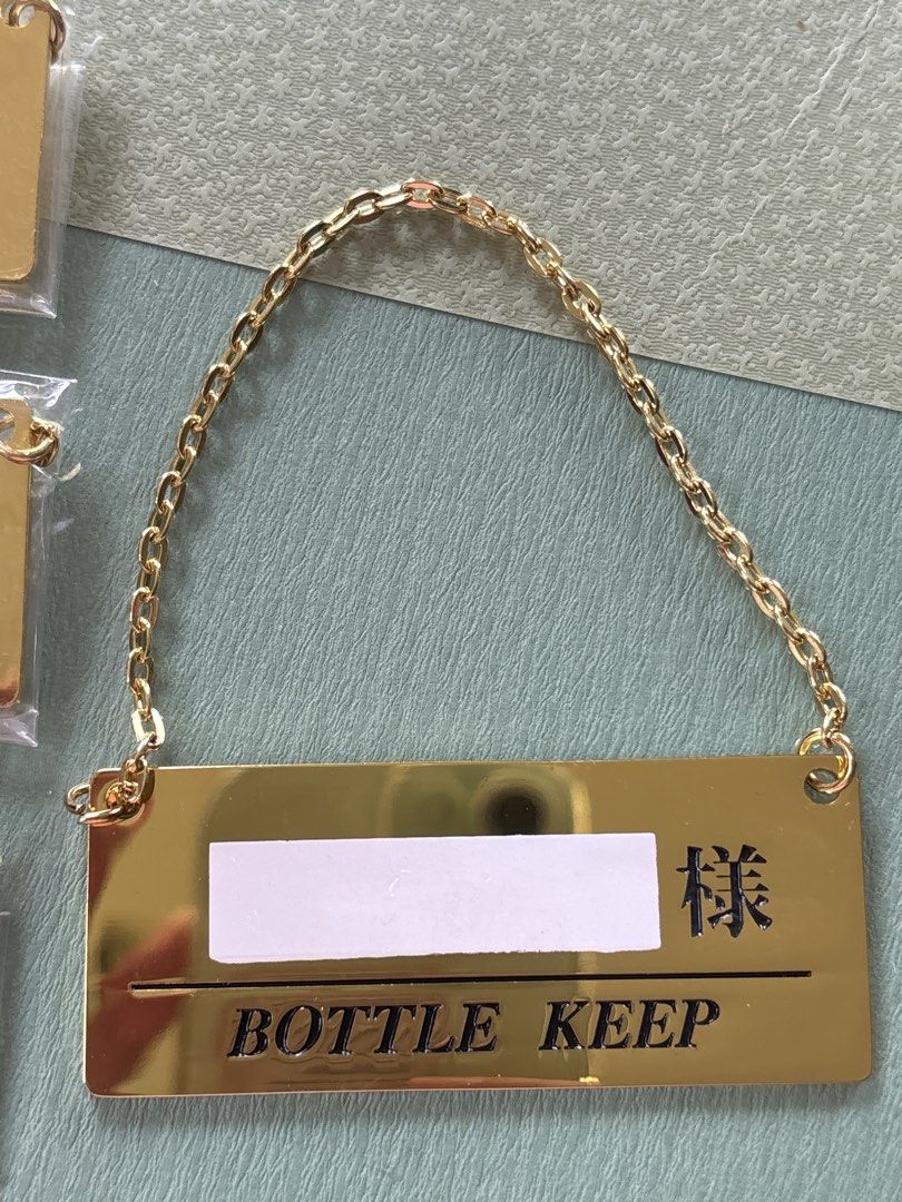 Bottle keep gold metal with chain tag (Category: Wine Cellar & Storage) located in Calamba. Submitted by cur8d (Listing ID 1467646195, Image 2). Description: 50 each.