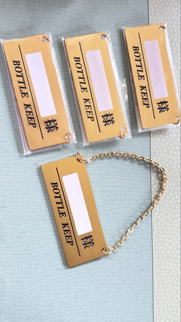 Bottle keep gold metal with chain tag (Category: Wine Cellar & Storage) located in Calamba. Submitted by cur8d (Listing ID 1467646195, Image 1). Description: 50 each.