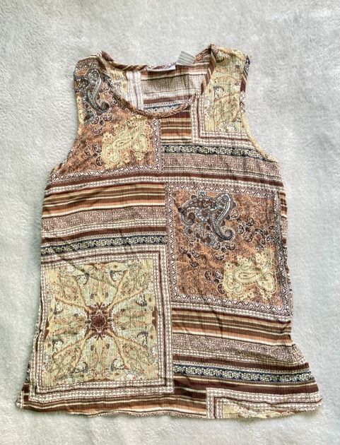 Brown Boho Paisley Patchwork Print Sleeveless Tank Top (Category: Sleeveless) located in Rizal. Submitted by sheeraay (Listing ID 1467665916, Image 2). Description: - Brown sleeveless top with patchwork paisley and striped panels - Lightweight and breathable fabric with a classic scoop neckline - Comfortable regular fit for everyday wear.