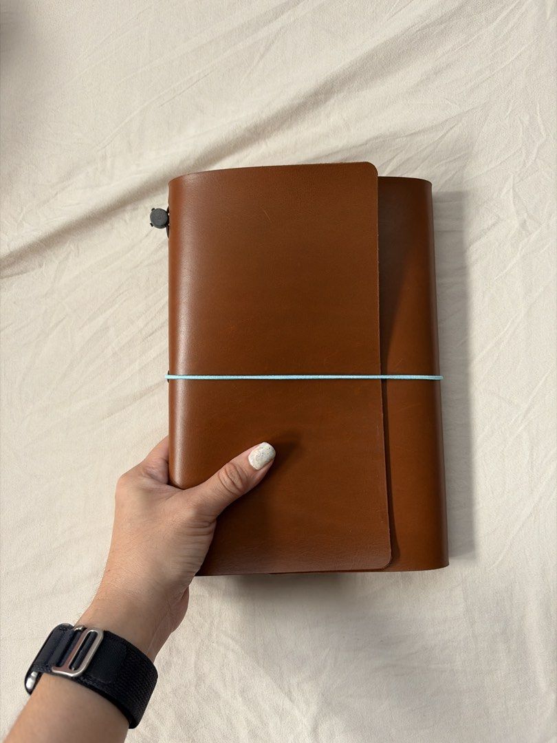 A5 genuine leather trifold journal cover (Category: Stationery & School Supplies) located in Quezon City. Submitted by minorchair (Listing ID 1467650721, Image 3). Description: - brand new, never used A5 genuine leather leather trifold journal cover in tan brown - with a light blue elastic cord - Filled with 2 free inserts - Versatile use: ideal for journaling, sketching, or daily planning.