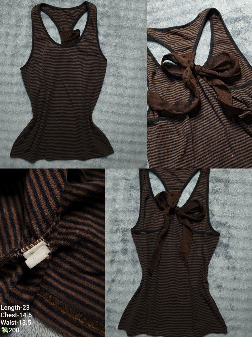 Brown Striped Tank Top with Back Ribbon (Category: Sleeveless) located in Floridablanca. Submitted by vintager12 (Listing ID 1467723115, Image 1). Description: - Style: Brown and black striped racerback tank top with a sheer ribbon tie detail at the back - Fit: Fitted silhouette with a slight flare at the hem - Material: Soft, stretchy ribbed knit - Measurements (laid flat): Length 23" | Chest 14.5" | Waist 13.5" - Condition: Worn a few times, ta