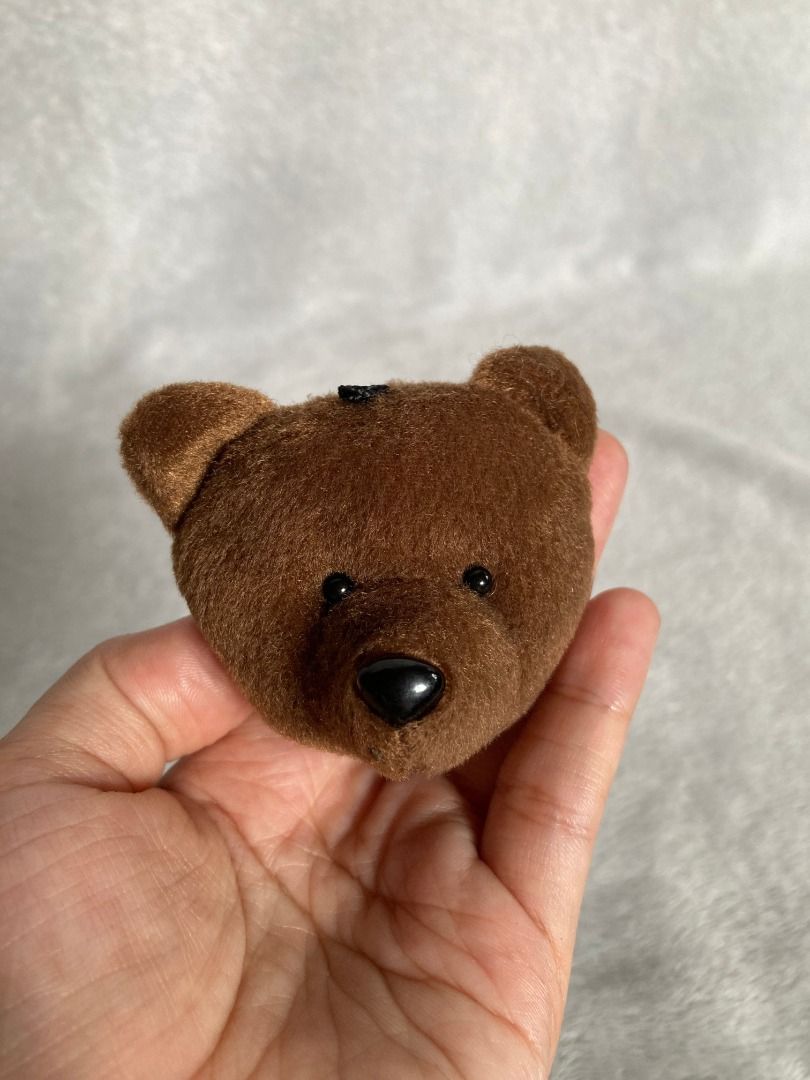 Brown Teddy Bear Phone Grip Holder Stand (Category: Mounts & Holders) located in Rizal. Submitted by sheeraay (Listing ID 1467707020, Image 2). Description: - Adorable fuzzy brown teddy bear design made with soft plush material - Features secure plastic nose and bead eyes for a cute look - Strong 3M adhesive backing for easy and reliable attachment to phone cases - Improves phone handling for easier one-handed use - Functions as a handy hands-fre
