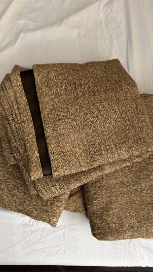 Brown textured curtains with dark brown lining (Category: Curtains & Blinds) located in Pasig City. Submitted by _missdee (Listing ID 1467671415, Image 2). Description: - Color: Brown woven fabric with dark brown smooth lining - Light Blocking: Thick material designed to effectively block out light - Quality: Premium, thick build for durability - Versatility: Neutral earth tones complement most living room and bedroom setups - Condition: Clean, w