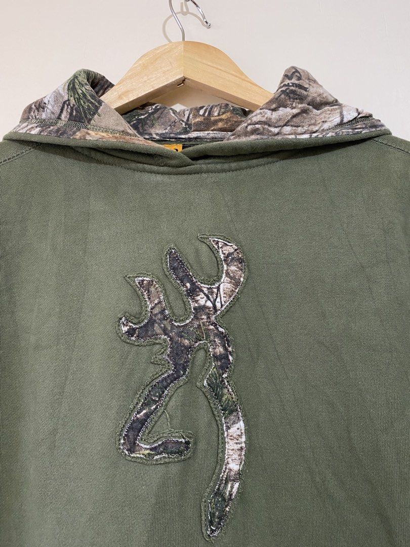 BROWNING, Realtree camo hood (Category: Coats, Jackets and Outerwear) located in Cavite. Submitted by jc_thrift95 (Listing ID 1467774577, Image 2). Description: - An olive green vintage Browning hoodie featuring a camo-lined hood and the iconic Buckmark logo on the chest. - X-large on tag (fits on small) - L- 23.5 inch - W- 20 inch - Color rate 8/10 - See picture details for dimes..