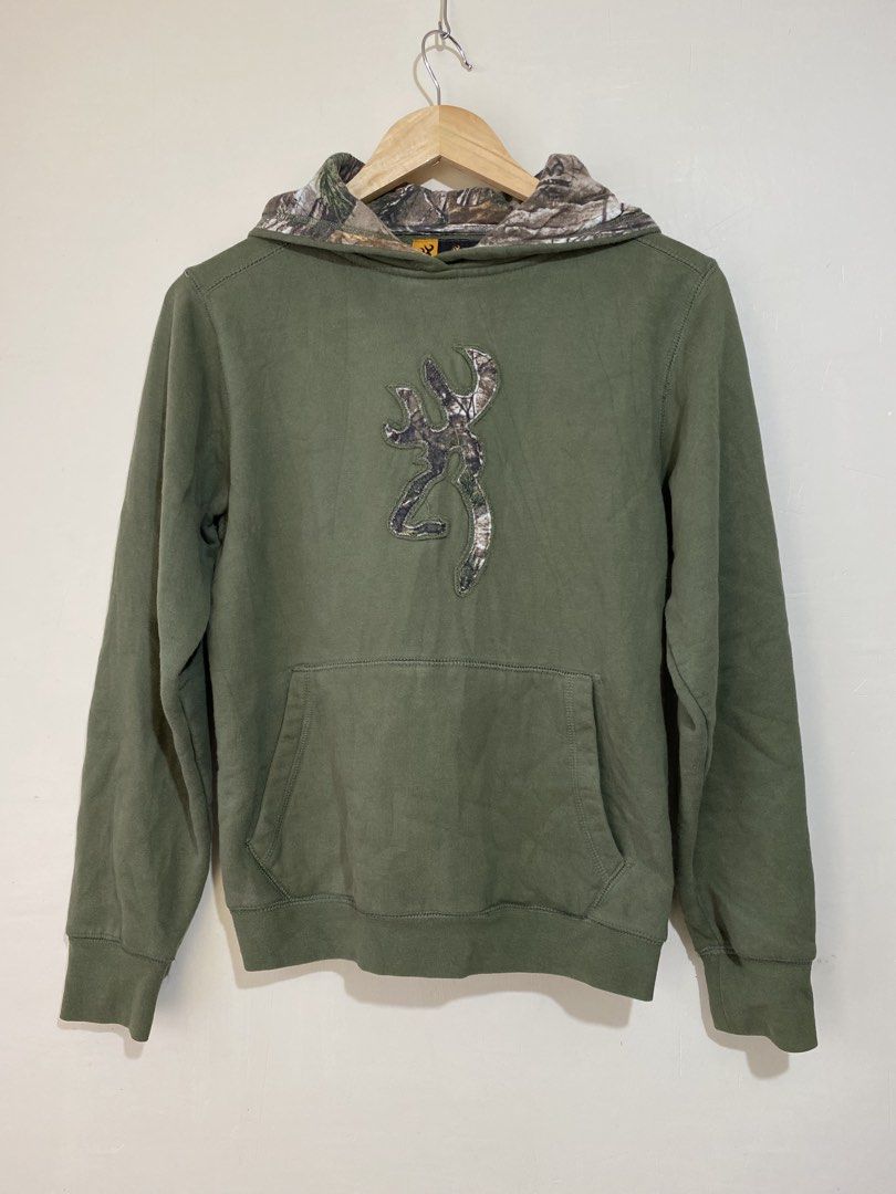 BROWNING, Realtree camo hood (Category: Coats, Jackets and Outerwear) located in Cavite. Submitted by jc_thrift95 (Listing ID 1467774577, Image 1). Description: - An olive green vintage Browning hoodie featuring a camo-lined hood and the iconic Buckmark logo on the chest. - X-large on tag (fits on small) - L- 23.5 inch - W- 20 inch - Color rate 8/10 - See picture details for dimes..
