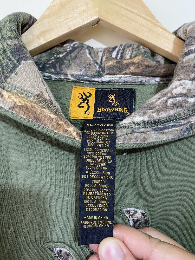 BROWNING, Realtree camo hood (Category: Coats, Jackets and Outerwear) located in Cavite. Submitted by jc_thrift95 (Listing ID 1467774577, Image 3). Description: - An olive green vintage Browning hoodie featuring a camo-lined hood and the iconic Buckmark logo on the chest. - X-large on tag (fits on small) - L- 23.5 inch - W- 20 inch - Color rate 8/10 - See picture details for dimes..