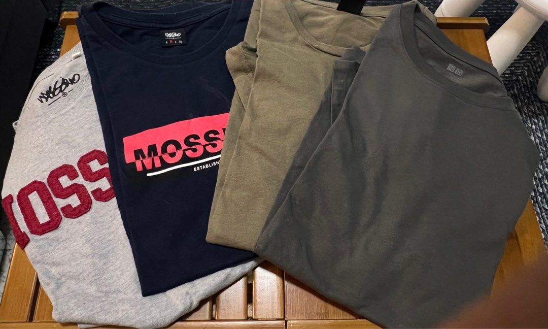Bundle of 4 Assorted T-Shirts Bundle Mossimo (Category: Tshirts & Polo Shirts ) located in Pasig City. Submitted by morilove (Listing ID 1467695983, Image 1). Description: - Set of 4casual t-shirts in Men's Size Medium - Brands included: Mossimo, Uniqlo - Colors: Black, grey, navy blue, and olive green - Designs: Mix of solid colors and stylish graphic prints - Neckline: Standard crew neck - Condition: Great daily wear rotation basics - DM for in