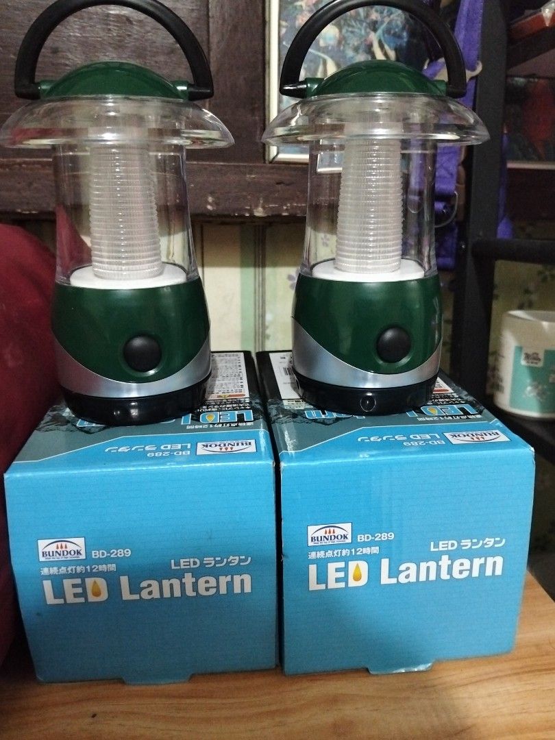 Bundok BD-289 LED Lanterns and Sleeping Bag Set (Category: Hiking & Camping) located in Abucay. Submitted by cristineca20489 (Listing ID 1467803065, Image 3). Description: - Bundle includes: 2x Bundok BD-289 LED lanterns (green) and 1x dark red Bundok sleeping bag - Condition: Both lanterns tested and working, emit bright white light (3 small batteries can last 12 hours.) - Packaging: Lanterns come with their original blue boxes - Sleeping Bag: F