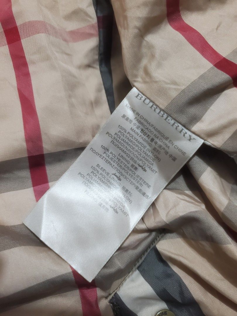Burberry Brit Quilted Down Jacket Green Size M (Category: Coats, Jackets and Outerwear) located in Manila. Submitted by royalrabbit.7b2a11 (Listing ID 1467743386, Image 3). Description: - Brand: Burberry Brit - Style: Quilted down jacket - Color: Olive green - Size: Medium - Material: 100% polyamide shell and lining with real down fill - Lining: Iconic Burberry check pattern - Features: Front zipper pockets and fur-lined collar for extra warmth -
