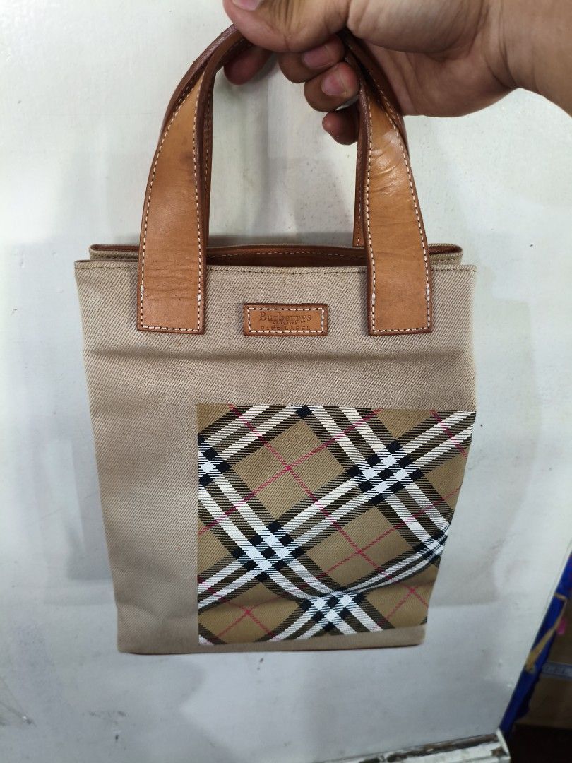 Burberrys nova check blue label handbag canvas brown (Category: Luxury Bags & Wallets) located in Puerto Princesa. Submitted by lotsstuff (Listing ID 1467629888, Image 2). Description: W22cm x H26cm x D8cm(Approx) Handle Drop:11cm(Approx) Size(Inch) W8.7 x H10.2 x D3.1inch(Approx) Handle Drop:4.3inch(Approx) Style Hand Bag Accessory There is no item box and dust bag. We will send only the item which is put in the photo..