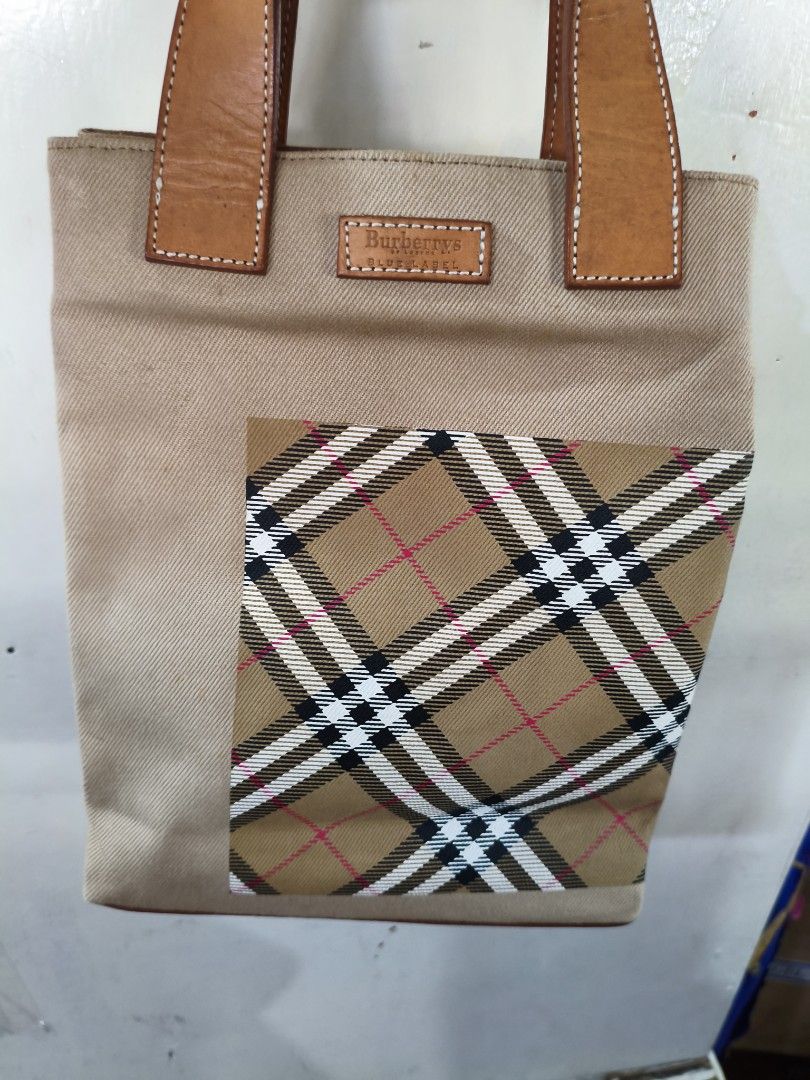 Burberrys nova check blue label handbag canvas brown (Category: Luxury Bags & Wallets) located in Puerto Princesa. Submitted by lotsstuff (Listing ID 1467629888, Image 3). Description: W22cm x H26cm x D8cm(Approx) Handle Drop:11cm(Approx) Size(Inch) W8.7 x H10.2 x D3.1inch(Approx) Handle Drop:4.3inch(Approx) Style Hand Bag Accessory There is no item box and dust bag. We will send only the item which is put in the photo..