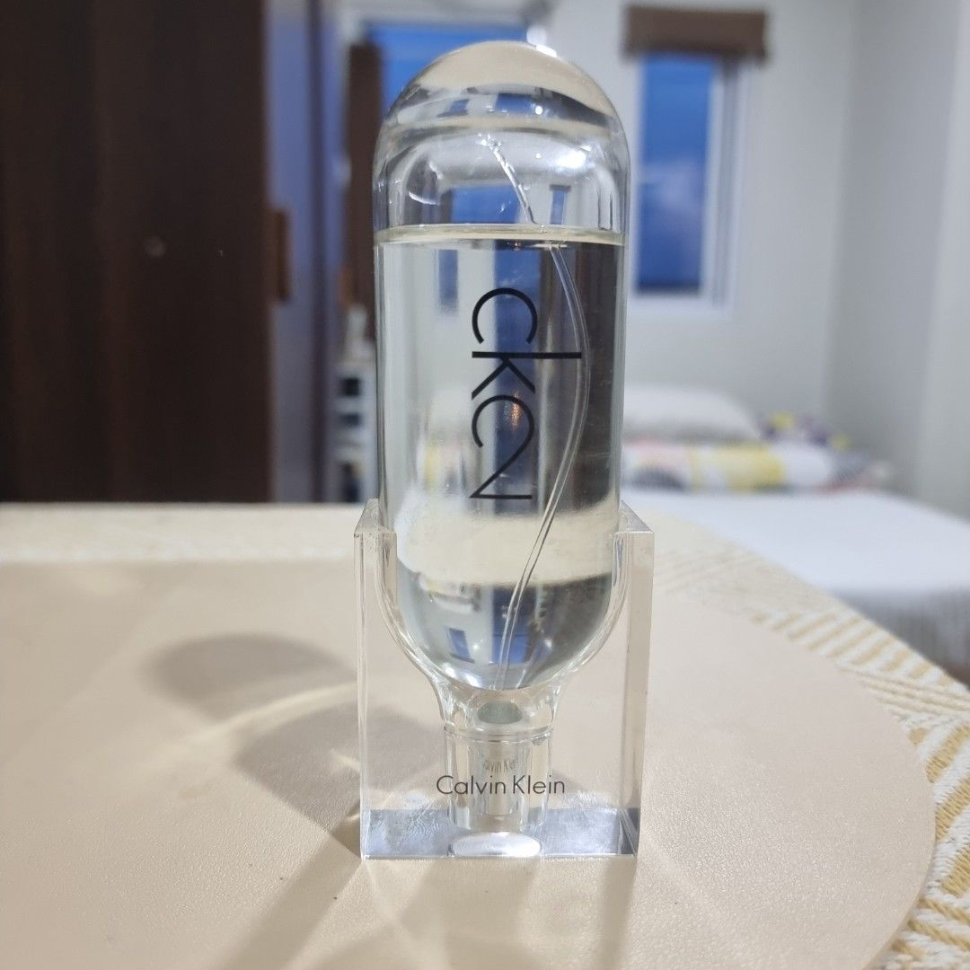 Calvin Klein CK2 Eau de Toilette (100 ml) (Category: Fragrance & Deodorants) located in Pasig City. Submitted by lesmitch (Listing ID 1467642926, Image 1). Description: - Authentic Calvin Klein CK2 Eau de Toilette - 85% Full | 100ml / 3.4 fl oz full-size bottle - Made in France by Coty Prestige - Sleek minimalist clear cylinder design with integrated transparent stand - Perfect for everyday casual wear or as a collector's piece ~ Check all photos