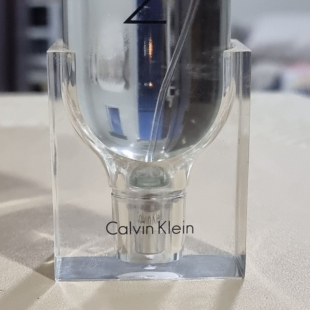 Calvin Klein CK2 Eau de Toilette (100 ml) (Category: Fragrance & Deodorants) located in Pasig City. Submitted by lesmitch (Listing ID 1467642926, Image 2). Description: - Authentic Calvin Klein CK2 Eau de Toilette - 85% Full | 100ml / 3.4 fl oz full-size bottle - Made in France by Coty Prestige - Sleek minimalist clear cylinder design with integrated transparent stand - Perfect for everyday casual wear or as a collector's piece ~ Check all photos