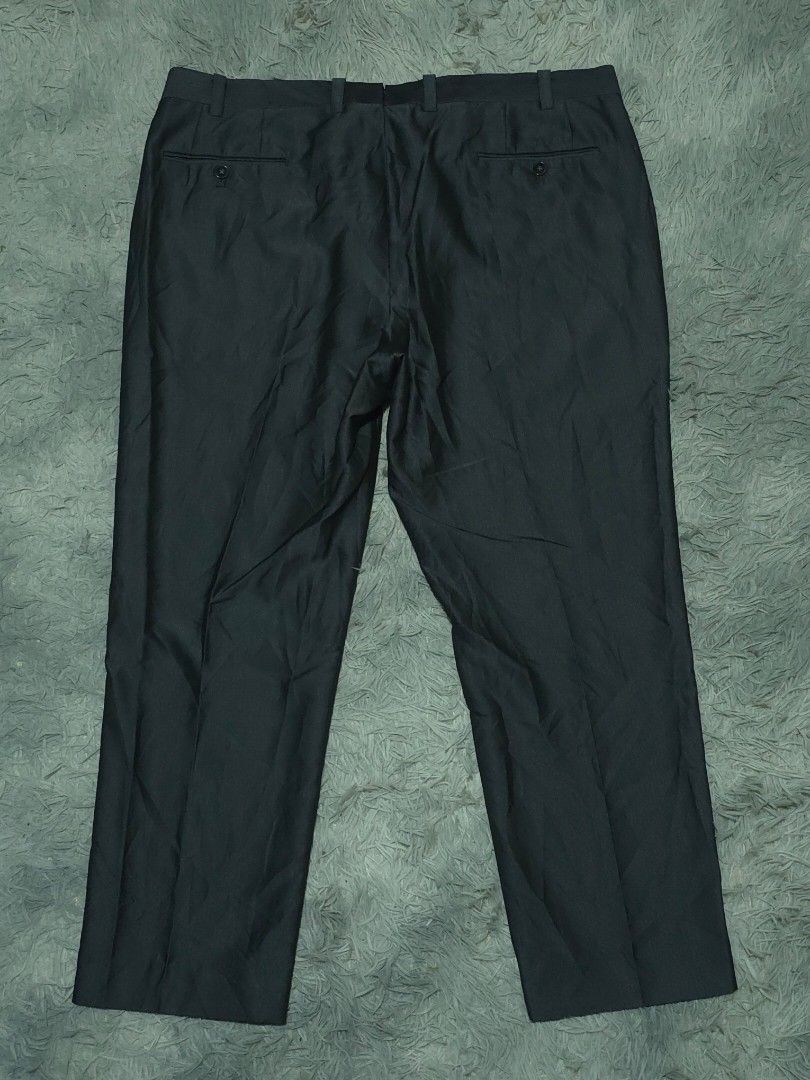 Calvin Klein Dark Grey Formal Trousers Pants (Category: Trousers) located in Abulug. Submitted by humanwhosellthings (Listing ID 1467640018, Image 2). Description: CALVÌN KLEIN Trouser Pants ✅Excellent Condition ✅Issue: none ▫️Waist Size: 38-40 ▫️Length: 38 - Fit: Straight cut design - Features: Belt loops, zip fly with button closure - Pockets: Two back pockets with button fastening - Ideal for: Office wear and formal events.