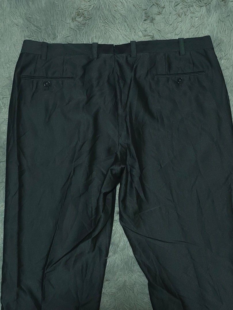 Calvin Klein Dark Grey Formal Trousers Pants (Category: Trousers) located in Abulug. Submitted by humanwhosellthings (Listing ID 1467640018, Image 3). Description: CALVÌN KLEIN Trouser Pants ✅Excellent Condition ✅Issue: none ▫️Waist Size: 38-40 ▫️Length: 38 - Fit: Straight cut design - Features: Belt loops, zip fly with button closure - Pockets: Two back pockets with button fastening - Ideal for: Office wear and formal events.