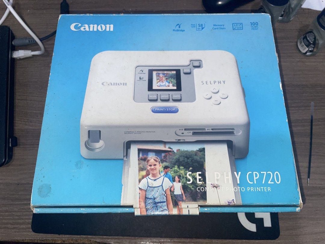 Canon Selphy CP720 Compact Photo Printer (Open Box / Powers On / Complete Set) (Category: Printers, Scanners & Copiers) located in San Juan City. Submitted by pilij (Listing ID 1467718779, Image 2). Description: Selling a highly collectible Canon Selphy CP720 Compact Photo Printer in essentially Open Box/Brand New condition. What is Included: This is a 100% complete set. It includes the original outer box, manuals, solution disk CD, and the origi