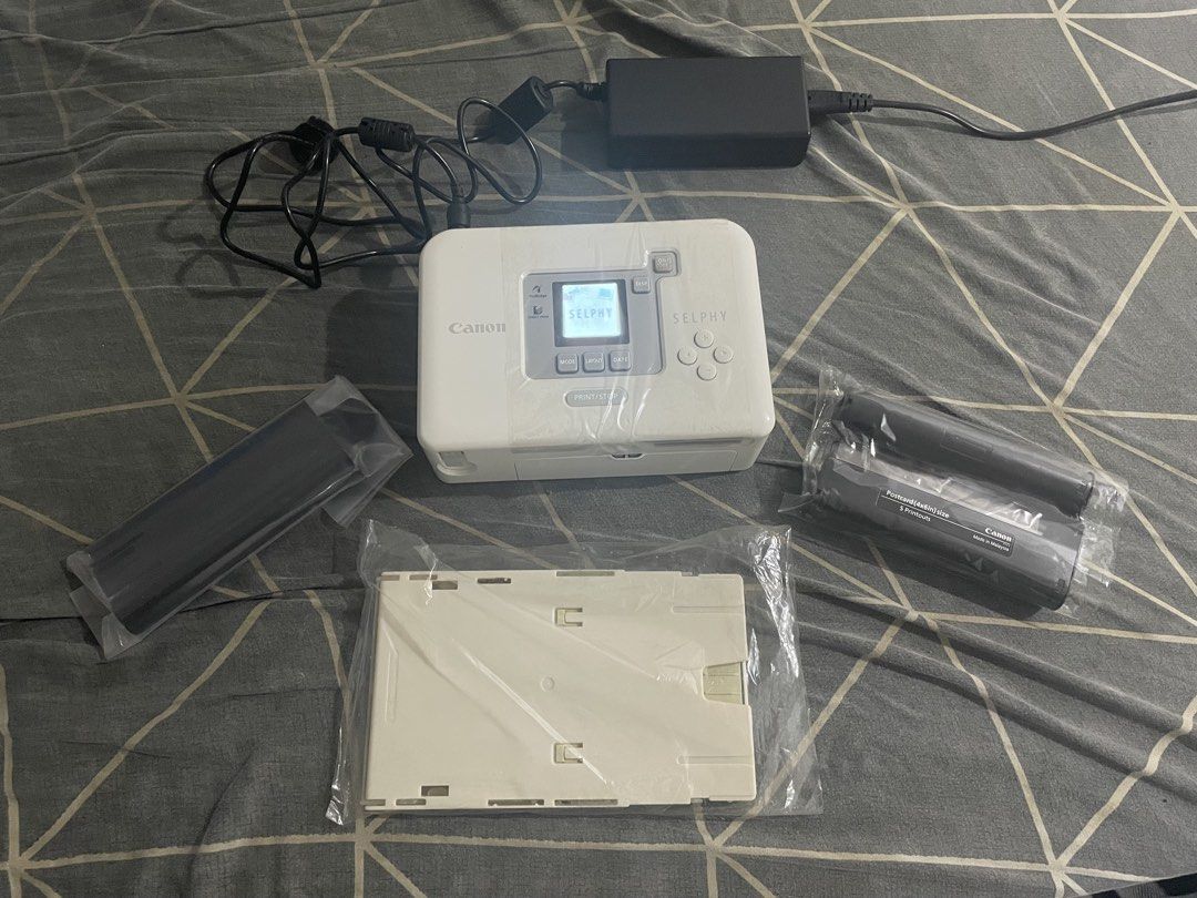 Canon Selphy CP720 Compact Photo Printer (Open Box / Powers On / Complete Set) (Category: Printers, Scanners & Copiers) located in San Juan City. Submitted by pilij (Listing ID 1467718779, Image 1). Description: Selling a highly collectible Canon Selphy CP720 Compact Photo Printer in essentially Open Box/Brand New condition. What is Included: This is a 100% complete set. It includes the original outer box, manuals, solution disk CD, and the origi