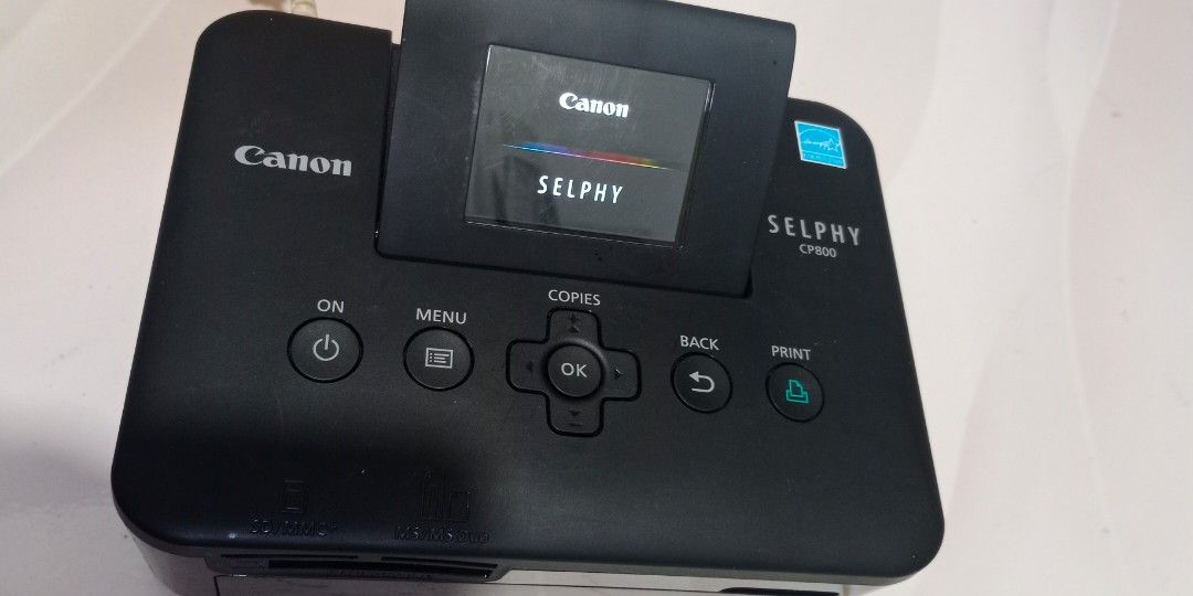 Canon selphy CP800 photo printer with issue (Category: Printers, Scanners & Copiers) located in Bulacan. Submitted by Shoppe.Ups (Listing ID 1467608981, Image 1). Description: for repair / parts / restoration power ok only unit only no charger or accessories included issue : stuck ung sa cartridge part what you see is what you get meetups: guiguinto plaridel bulacan - J&T *(Payment First) - LBC COP/COD *(payment first for shipping fee only) -pick