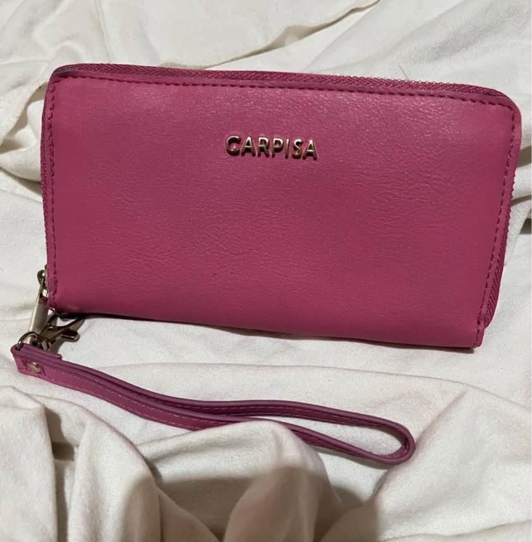 Carpisa Pink Zip Around Wallet With Wrist Strap (Category: Wallets & Card holders) located in Taguig. Submitted by mikacxz (Listing ID 1467732399, Image 1). Description: - never used - rfs: decluttering .