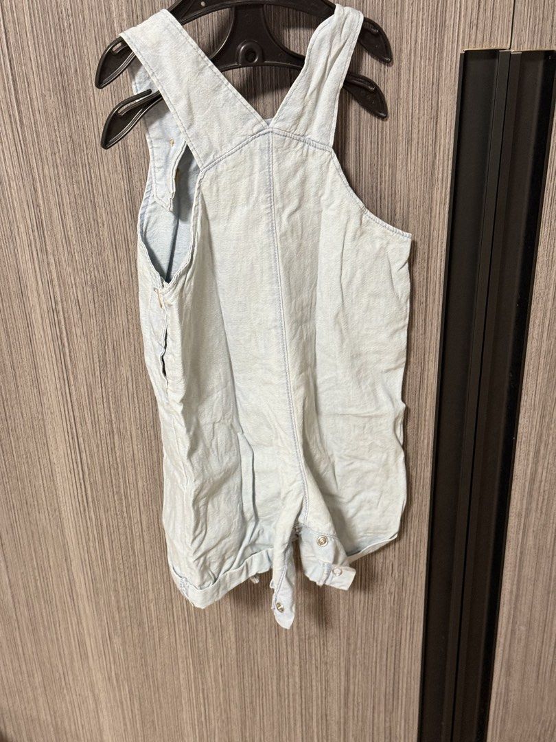 Carters baby denim rompers light wash (Category: Babies & Kids Fashion) located in Quezon City. Submitted by ketch10 (Listing ID 1467652107, Image 3). Description: - Adorable light wash denim baby overalls - Features a cute 'Little Wild One' lion patch on the chest pocket - Wooden-style buttons on the straps and sides - Convenient snap buttons along the crotch for easy diaper changes - Short legs with trendy cuffed hems - Soft and comfortable fab
