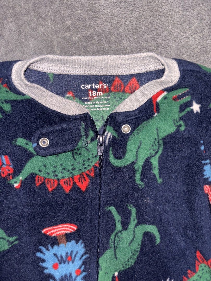 Carter's Christmas Dinosaur Fleece (Category: Babies & Kids Fashion) located in Quezon City. Submitted by closettreasure123 (Listing ID 1467677547, Image 2). Description: Flaw: torn seam right next to the zipper tape (as seen on the 3rd pic) just needs sewing Full-body sleeper with attached footies, a full-length safety zipper stretching from the collar down to the leg, and a snap-tab closure over the zipper tab at the neckline to protect delicat